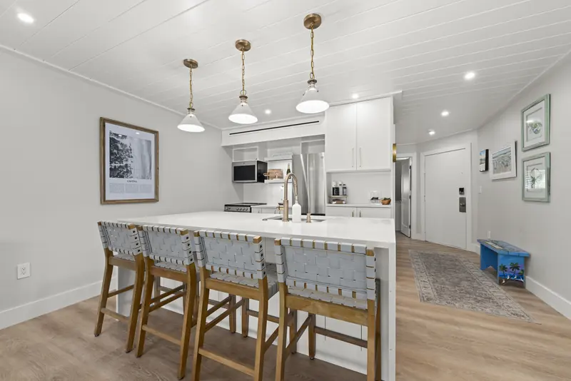 Custom kitchen with quartz island and seating